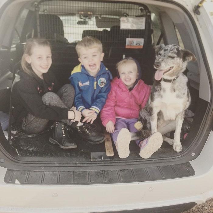 Children clicking photo with a koolie