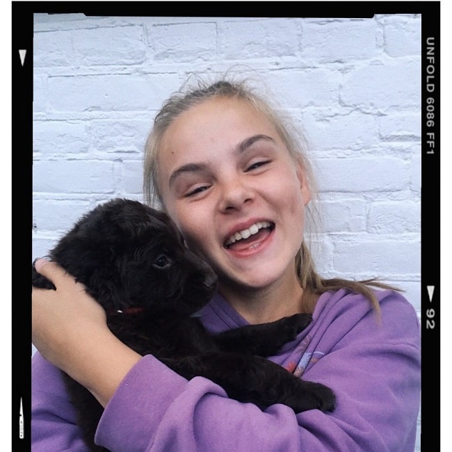 A girl and Frisian Water Dog