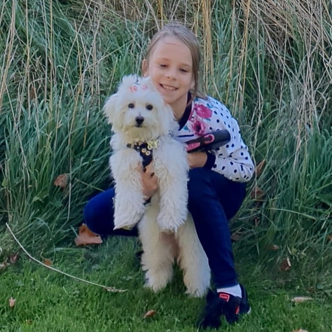 A girl and Maltipoo