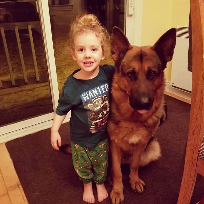 A girl posing with the King Shepherd