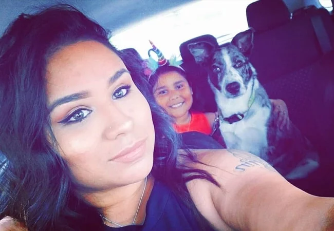 A mother taking selfie with her daughter and Catahoula Australian Shepherd